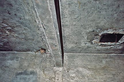 One of the four reconstructed holes in the ceiling of the Auschwitz gas chamber