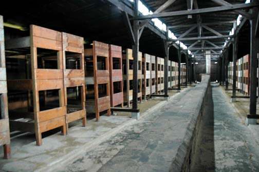 Bunk beds in the quarantine barracks which are shown to tourists at Auschwitz-Birkenau