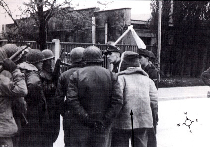 SS 2nd Lt. Heinrich Wicker surrenders Dachau camp to Brig. Gen. Henning Linden on April 29, 1945