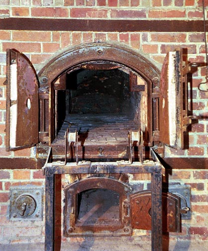 One of several ovens at Dachau where tourists can pose for a photo