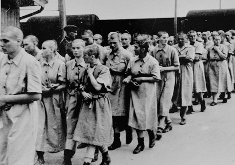 Women at Birkenau wearing dresses after taking a shower