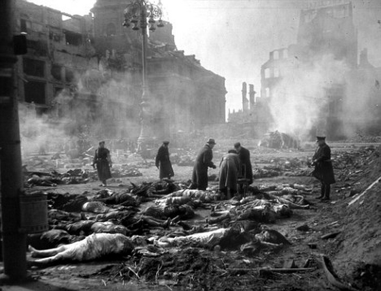 (FILES) Photo dated 25 February 1945 showing residents and emergency personnel lining up bodies to be burned at the Old Market in the east German city of Dresden, following allied bombings 13 February 1945. The 60th anniversary of the massive fire bombing of the city, which killed anywhere between 25.000 to 135.000 people, many of them refugees fleeing the Russian advance, will be commemorated in Dresden 13 February 2005, amidst calls by far-right parties to hold a mass rally in Dresden on the occasion. AFP PHOTO SLUB DEUTSCHE FOTOTHEK/WALTER HAHN (Photo credit should read WALTER HAHN/AFP/Getty Images)